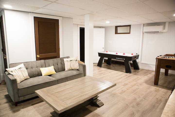 Game room with air hockey, foosball, and arcade games